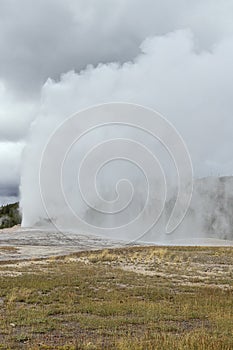 Huge steam clouds and mist above Old Faithful