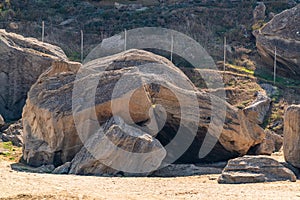 Huge stone boulders on the mountainside. Grotto