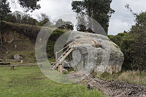 Huge stone with staircase used as a tourist viewpoint, on a Tota Lake island