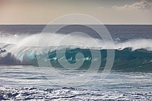 Huge surfing waves against ocean water background