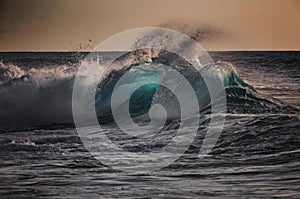 Huge surfing waves against ocean water background