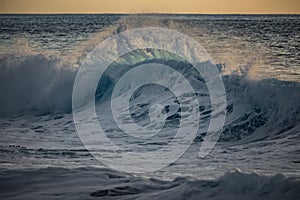 Huge surfing waves against ocean water background