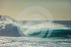 Huge surfing waves against ocean water background