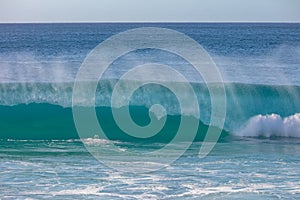 Huge surfing waves in ocean water