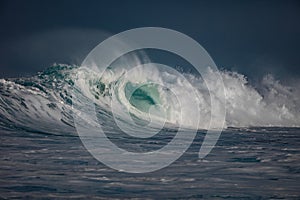 Huge surfing waves in ocean water during storm