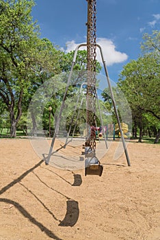 Huge swing set in nature park with tree lush at Ennis, Texas, US