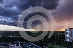 Huge thundercloud on the outskirts of the city before the rain - image