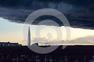 Huge thundercloud on the outskirts of the city before the rain - image