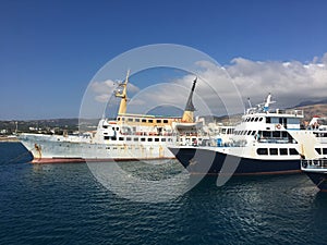 A huge tourist ship in the port on a bright sunny day. Cruise ship docked in port. Concept: tourism and travel