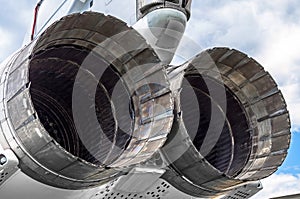 Huge turbines of the aircraft engine of a military fighter.