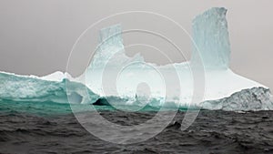 Huge unique glacier iceberg in ocean of Antarctica.