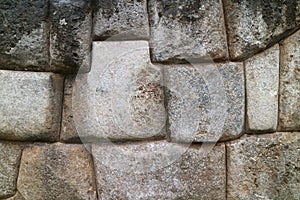 The huge wall of the citadel of Sacsayhuaman, unique stonework of the ancient Inca Cusco, Peru