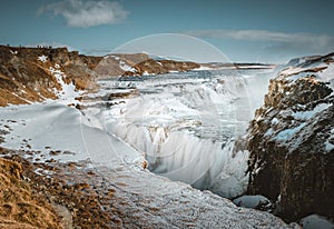 Huge waterfall Gullfoss Golden Fall in the morning mist. Colorful winterscene on Hvita river in southwest Iceland photo