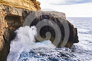 Huge waves crash on cloudy day. Kemmuna island