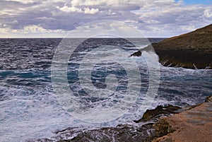 Huge waves crash on cloudy day. Kemmuna island