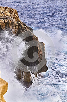 Huge waves crash on cloudy day. Kemmuna island