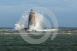 Huge Waves Surround New England Lighthouse