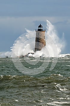 Huge Waves Surround Stone Lighthouse Tower in Maine