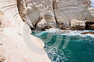 Huge white chalk cliffs, rocks, mountains on Northern Mediterranean Sea Coast in Rosh Hanikra, Israel