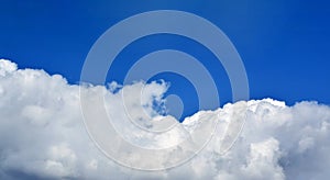 Huge white cloud on blue sky