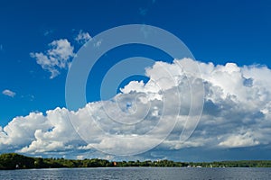 A huge white cloud over the lake