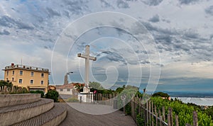 The huge white cross of Mont Saint Clair, overlooking the lagoon and the sea, and protecting the city of Sète, Occitanie, France