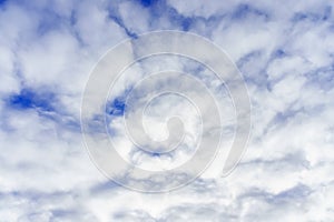 Huge white, fluffy clouds against the blue sky.