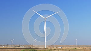 Huge wind generators against blue sky