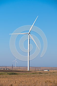 Huge wind generators against blue sky