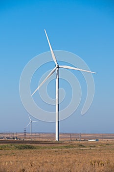 Huge wind generators against blue sky