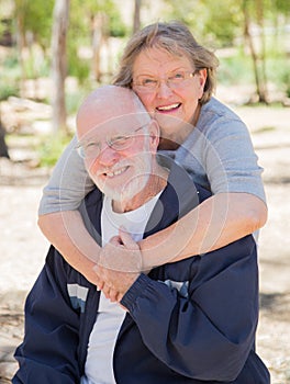 Hugging Senior Couple Portrait Outdoors