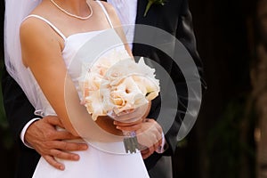 Hugging with white roses