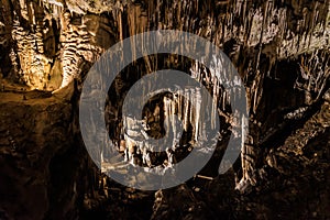 Hughe cave with stalagmites and stalactites in the Karst area