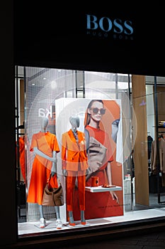 Hugo Boss fashion store, exposition, window shop with modern bags, clothes, shoes from Hugo Boss fashion house