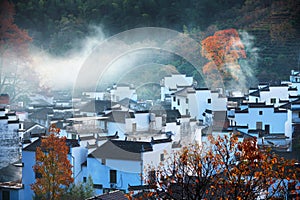 The Hui style architecture in the foot of mountains in autumn