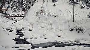 Huk waterfall, frozen waterfall at winter, Carpathian National Park. Ukraine.