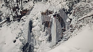 Huk waterfall, frozen waterfall at winter, Carpathian National Park. Ukraine.