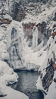 Huk waterfall, frozen waterfall at winter, Carpathian National Park. Ukraine.