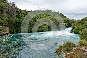 Wide view of Huka Falls flowing into Waikato, Taupo, New Zealand