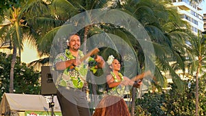 Hula dancers with puili at waikiki in hawaii