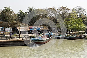 Hularhat, Bangladesh, February 27 2017: Settlement with pier and boat