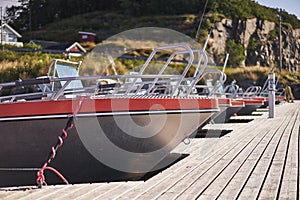 Hull of aluminium sport fishing speed boat at the public pier.