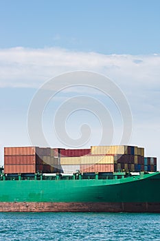 Hull of a big ship loaded with containers
