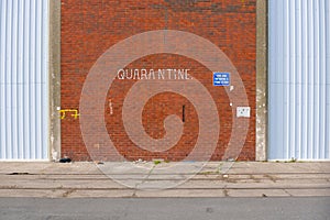 Quarantine sign on the wall photo