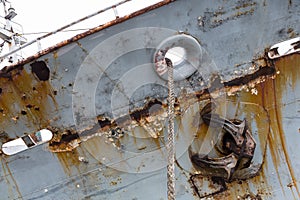 Hull of an old abandoned ship with an anchor