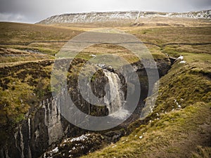 Hull Pot lies on the western side of Pen-y-ghent in the Yorkshire Dales