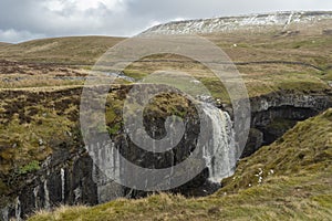 Hull Pot lies on the western side of Pen-y-ghent in the Yorkshire Dales