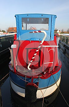 Hull of red narrowboat