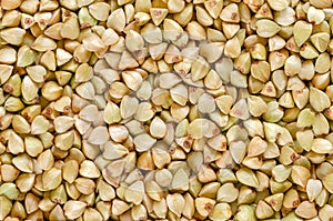 Hulled common buckwheat grains macro photo from above