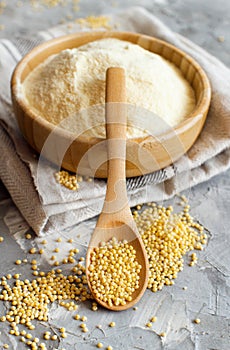 Hulled millet flour and grain in a bowl